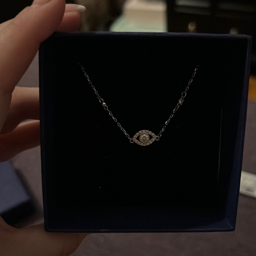 Swarovski eye necklace.
